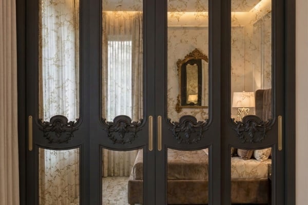 An ornate mirror sliding wardrobe