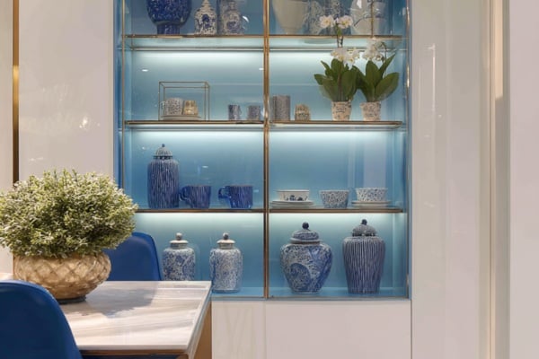 Coloured interiors paired with glass shelves