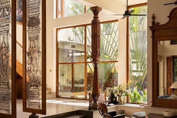 Dining and living area separated by toughened glass partitions