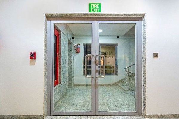 Fire-rated glazing system integration in buildings