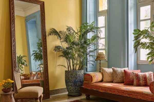 Full-height mirrors make ceilings feel taller and spaces more layered. 